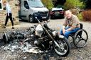 David Burdus with his destroyed Martin Conquest trike at his home