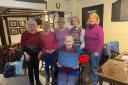 The six remaining Felindre WI members, pictured with the commemorative plaque which they have given to the village hall committee.