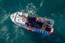 A fisherman landing his catch