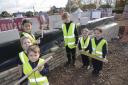 Grove Primary School council turned builders for the day to lay the first bricks of their new extension.