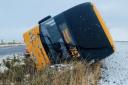 A Stagecoach bus toppled on its side amid icy conditions