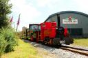 Lappa Valley’s flagship Engine Zebedee (red) pulls a train along the mainline, assisted by the attractions latest locomotive “City of Truro”