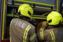 Firefighter officers running through a practice drill