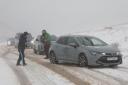 Cars have been left stranded as heavy snow hits Scotland