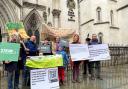 Alison White, founder of campaign group Save the Trees of Armada Way (Straw), (centre) with fellow campaigners outside the Royal Courts of Justice in London.