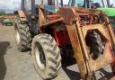 I use my old 1965 Massey Ferguson 65, which operates a saw bench in the mill as well as doing the hay