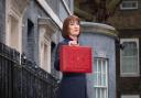 Chancellor of the Exchequer Rachel Reeves poses for photographs as she leaves 11 Downing Street, London, before delivering her first Budget to the Houses of Parliament