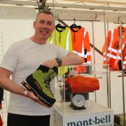 James Bradshaw shows off Zamberlan and MontBell's new products on the Carr's Billington Safety stand