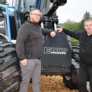 Timmo, left, and Poul Thuesen with Euromatic’s 8230TH harvester.