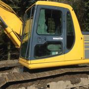 The lord's excavator had a run-in with a lodgepole pine