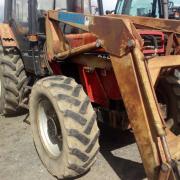 I use my old 1965 Massey Ferguson 65, which operates a saw bench in the mill as well as doing the hay