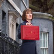 Chancellor of the Exchequer Rachel Reeves poses for photographs as she leaves 11 Downing Street, London, before delivering her first Budget to the Houses of Parliament