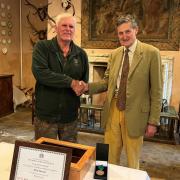 Mick Beeson, left, was given his award by estate owner Philip Naylor-Leyland